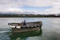 Man and boat in Yaquina Bay in Newport on the Oregon Coast