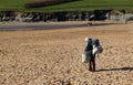 Newquay, Cornwall, UK - April 7 2018: Lone homeless woman or bag