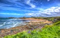 Newquay surfing beach Cornwall uk in colourful hdr with cloudscape Royalty Free Stock Photo