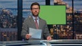 News announcer showing mockup screen reporting breaking news tv channel studio Royalty Free Stock Photo