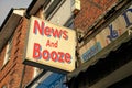 News and Booze sign outside newsagents store in North London Royalty Free Stock Photo