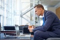 News, coffee focus and businessman with a laptop for work, communication and internet. Business, working and man reading Royalty Free Stock Photo