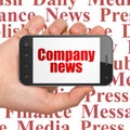 News concept: Hand Holding Smartphone with Company News on display Royalty Free Stock Photo