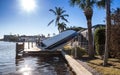 NEWS Ã¢â¬â Flipped Boat pushed on land during Hurricane Ian storm surge flooding in Naples, Florida Royalty Free Stock Photo