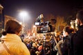 News media journalist film protest event with crowd in Georgia capital Tbilisi streets