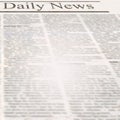 Daily news newspaper with headline and old unreadable text Royalty Free Stock Photo