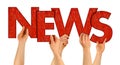 NEWS people holding up red wooden letters isolated Royalty Free Stock Photo