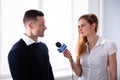 News Reporter Asking Question To Businessman