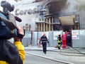 News reporter and building on fire Royalty Free Stock Photo