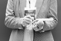 Female journalist at news conference or media event, writing notes, holding microphone Royalty Free Stock Photo