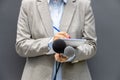 News reporter or TV journalist at press conference or media event, holding microphone and writing notes. Broadcast journalism. Royalty Free Stock Photo