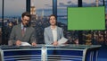 Newscasters broadcasting green screen news late studio closeup. Anchors talking Royalty Free Stock Photo