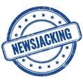 NEWSJACKING text on blue grungy round rubber stamp