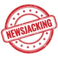 NEWSJACKING text on red grungy round rubber stamp