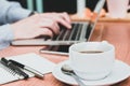 newsletter concept Hand of businessman or designer checking message box on digital laptop with coffe cup on desk Royalty Free Stock Photo