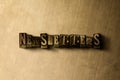 NEWSLETTERS - close-up of grungy vintage typeset word on metal backdrop