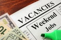 Newspaper with ads weekend jobs vacancy.