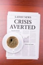 The newspaper CRISIS AVERTED and coffee Royalty Free Stock Photo