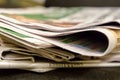 Newspaper edge stack of paper editions news gossip source of information morning tradition breakfast fresh coffee page spacing Royalty Free Stock Photo