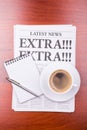 The newspaper EXTRA! EXTRA! and coffee