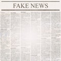 Newspaper with headline Fake News and old unreadable text Royalty Free Stock Photo