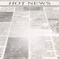 Newspaper with headline Hot News and old unreadable text Royalty Free Stock Photo