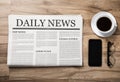 Newspaper with the headline News and glasses and coffee cup on wooden table, Daily Newspaper mock-up concept Royalty Free Stock Photo