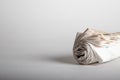 newspaper roll with white background, negative space Royalty Free Stock Photo