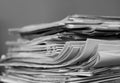 newspaper rolled up and sitting on a table no people stock photo Royalty Free Stock Photo