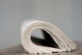 newspaper rolled up and sitting on a table no people stock photo Royalty Free Stock Photo