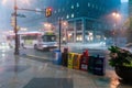 Newspaper stands during rain storm in downtown Philadelphia, Pennsylvania