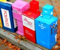 Newspaper vending boxes on city street