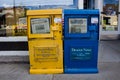 Newspaper vending machines on a storefront in Coalville, UT