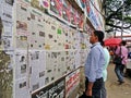 Daily newspaper on the wall in the streets of Dhaka