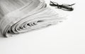 Newspapers with eyeglasses on white background Royalty Free Stock Photo