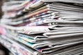 Newspapers folded and stacked on the table background. Colorful newspaper. Image shallow depth of field
