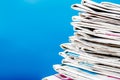 Newspapers folded and stacked on the table with blue background.Closeup stack newspaper and selective focus image.Time to read con Royalty Free Stock Photo