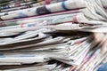 Newspapers folded and stacked on the table. Closeup newspaper and selective focus image