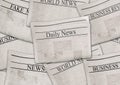 Newspapers with headlines on horizontal surface. Old newspaper background Royalty Free Stock Photo