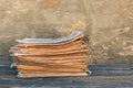 Newspapers and magazines on old wood background. Royalty Free Stock Photo