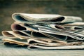 Newspapers and magazines on old wood background Royalty Free Stock Photo