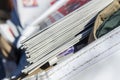 Newspapers stacked in bike delivery sack bag Royalty Free Stock Photo