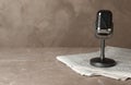 Newspapers and vintage microphone on marble table, space for text. Journalist`s work Royalty Free Stock Photo
