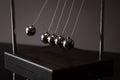 Newton cradle representing momentum