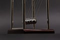 Newton`s cradle on on a black background. Business Royalty Free Stock Photo