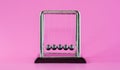 Newton`s cradle physics concepts for action and reaction or cause and effect On the pink background