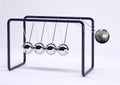 Newton`s cradle with planet earth