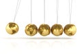 Newtons cradle with golden globes formed by