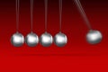 Newtons cradle idea on red