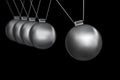 Newtons cradle silver balls on black background